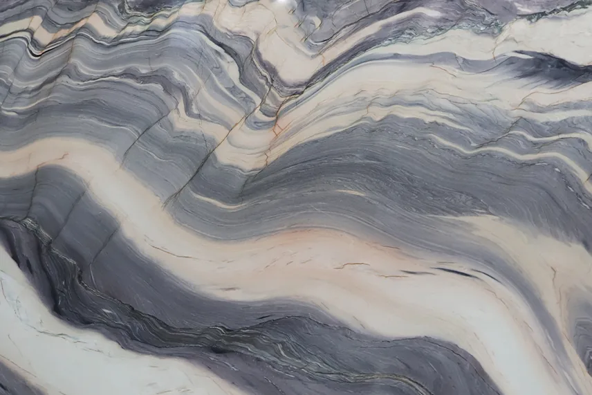 Close-up van Explosion Blue kwartsiet: grote golven in grijs, beige en roze